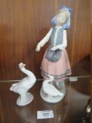 A LLADRO FIGURE OF A LADY FEEDING A DUCK, TOGETHER WITH A LLADRO DUCK FIGURE (2)