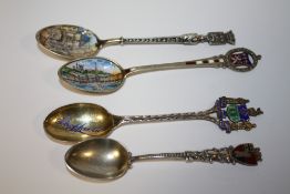 FOUR SILVER AND ENAMEL TEASPOONS