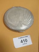 A HALLMARKED SILVER CIRCULAR COMPACT