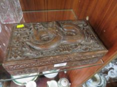A HEAVILY CARVED ORIENTAL HARDWOOD LIDDED BOX