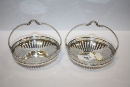 A PAIR OF WMF CIRCULAR SILVER PLATED BASKETS, with openwork and Greek key design border, basket