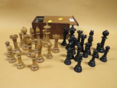 A BOX OF VINTAGE CARVED WOODEN CHESS PIECES IN BOX MARKED CHASSEREAU'S WAREHOUSE