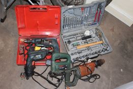 A CASED BOSCH DRILL, CASED TOOL KIT PLUS TWO OTHER DRILLS AND A JIGSAW