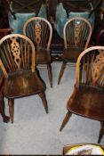 A SET OF FOUR OAK WHEELBACK CHAIRS