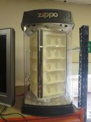 A LARGE MODERN REVOLVING ZIPPO LIGHTER SHOP DISPLAY UNIT