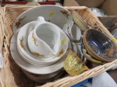 A WICKER BASKET OF ASSORTED CHINA TO INCLUDE AN ADDERLY GILT CUP AND SAUCER ETC.