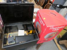 A VINTAGE TIN TRUNK CONTAINING ASSORTED STATIONARY, TOGETHER WITH A BOXED ILLUMINATED GLOBE