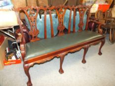 A MODERN CHIPPENDALE STYLE CARVED THREE SEATER BENCH / SOFA - W 164 CM