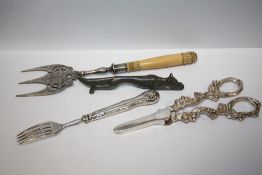 A WILLIAM IV SILVER FORK, TOGETHER WITH A FOX SHAPED KNIFE REST ETC. (4)