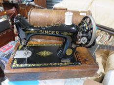 A CASED VINTAGE SINGER SEWING MACHINE