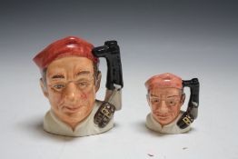 TWO ROYAL DOULTON CHARACTER JUGS FROM WILLIAMSBURG - BOOTMAKER, consisting of small D6586 and mediu