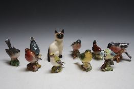 A COLLECTION OF NINE BESWICK BIRDS AND A DOULTON CAT