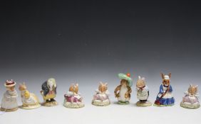A COLLECTION OF NINE ROYAL DOULTON AND BESWICK BEATRIX POTTER AND BRAMBLY HEDGE FIGURES, tallest 10