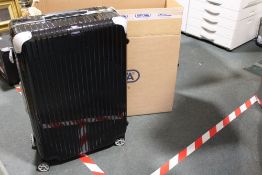 A LARGE RIMOWA BLACK PATENT HARDSHELL SUITCASE