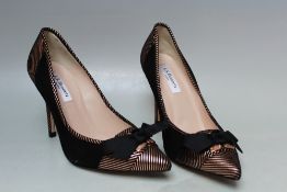 A PAIR OF L.K. BENNETT BLACK AND GOLD POINTED COURT SHOES, size EU 37 1/2