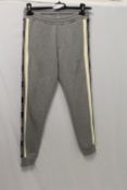 MONCLER, a child's track suit in grey, size 14