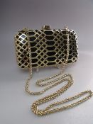 A SMALL BIBA GOLDTONE / BLACK CLUTCH BAG, with gemset push release / snap closure , optional