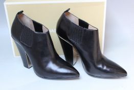 A BOXED PAIR OF MICHAEL KORS 'LACY' BLACK LEATHER BOOTS, EU size 39 1/2Condition Report:Minimal