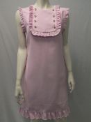 GUCCI, a ladies pink dress with ruffle placket