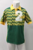 COMME DES GARCONS, a gents polo shirt, green and yellow with No 2 to front, size X