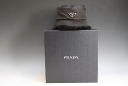 A BLACK PRADA UNISEX HAT AND BOX - SIZE L