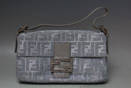 A FENDI SILVER METALLIC MONOGRAM BAGUETTE EVENING BAG, with leather strap and decorative buckle stud