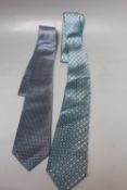 TWO ARMANI COLLEZIONE TRADITIONAL GENTS TIES, comprising one aqua and one navy patterned examples.
