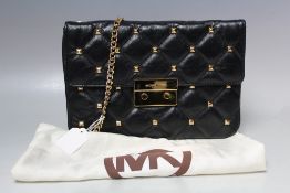 A MICHAEL KORS BLACK QUILTED LEATHER BAG WITH STUD EMBELLISHMENT, with gold tone hardware and