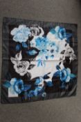 A LADIES 'OFF WHITE' SILKY FABRIC SQUARE SCARF, with rose pattern on white grey and black ground,