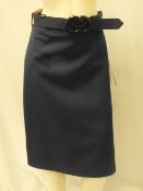 GUCCI, a ladies navy skirt with buckle belt