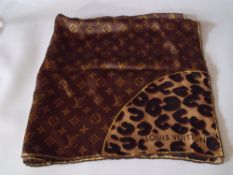 A LOUIS VUITTON ITALIAN SILK SCARF, leopard print to corner panels with monogram to main body of