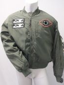 P.A.M. (PERKS AND MINI), a green mens bomber jacket with detail
