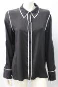 DIANE FURSTENBURG, a ladies black & white blouse, size 10