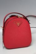 A PRADA MINIATURE RED BACKPACK, zip fastening, W 18 cm