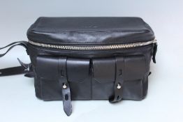 A KARL LAGERFIELD BLACK LEATHER SQUARE HANDBAG, zip fastening with pockets to the front, W 38 cm