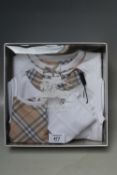 A BOXED BURBERRY LAYETTE SET, bib, baby suit and hat
