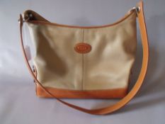 A TODS TAN AND NUDE LEATHER SMALL HANDBAG, with stud detail to sides and base, zip closure, H 25 cm,