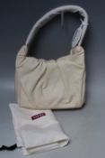 A STAUD FELIX HANDBAG, ivory, magnetic fastening, dust bag, W 25 cm