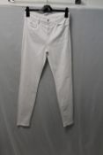 J BRAND, a pair of l;ladies white jeans, size 28