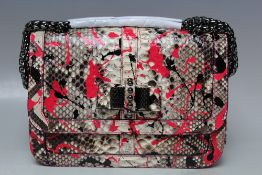 A CHRISTIAN LOUBOUTIN SNAKESKIN SWEET CHARITY EVENING BAG, double metal link handles, ribbon