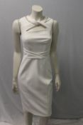 KAREN MILLEN, a ladies white / ivory dress, slashed and crossed to front, size UK 8