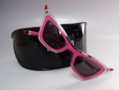 A PAIR OF RETRO 1950S STYLE MOSCHINO 'LIPSTICK' SUNGLASSES IN FUSHIA, new / old stock with case