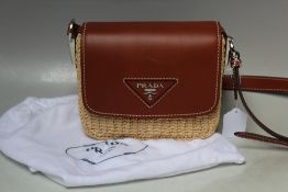 A PRADA BASKET WEAVE AND LEATHER HANDBAG, W 21 cm