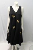 ISSA, a ladies black and gold braid dress, size 18