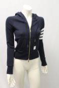 TOM BROWNE, a ladies navy shirt with zip side, size 8-10