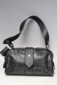A VIVIENNE WESTWOOD EMBOSSED BLACK LEATHER HANDBAG, flat leather handle, over-sized zip fastening,
