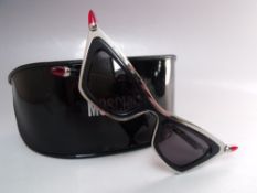 A PAIR OF RETRO 1950S STYLE MOSCHINO 'LIPSTICK' SUNGLASSES IN BLACK, new / old stock with case and