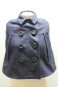A BURBERRY CHILDS NAVY CAPE, with typical check lining, size medium