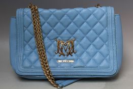 A LOVE MOSCHINO BLUE QUILTED HAND BAG, with two metallic straps, typical logo to the front S/