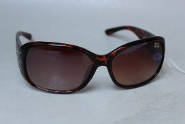 A PAIR OF BROWN TORTOISESHELL DESIGNER SUNGLASSES